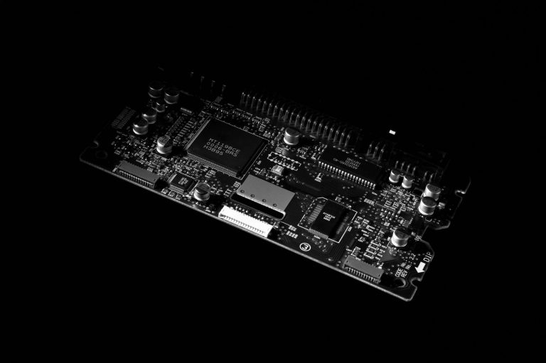 Detailed black and white image of a computer circuit board, showcasing technology components. — Keep Tenant Records Organized