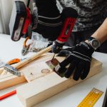 A craftsman uses a power drill on wood, showcasing carpentry tools and skills. — "Windows of Fort Lauderdale: Where Style Mee